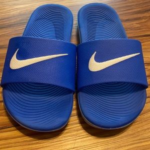 Boys blue Nike slide ons. Size 3Y